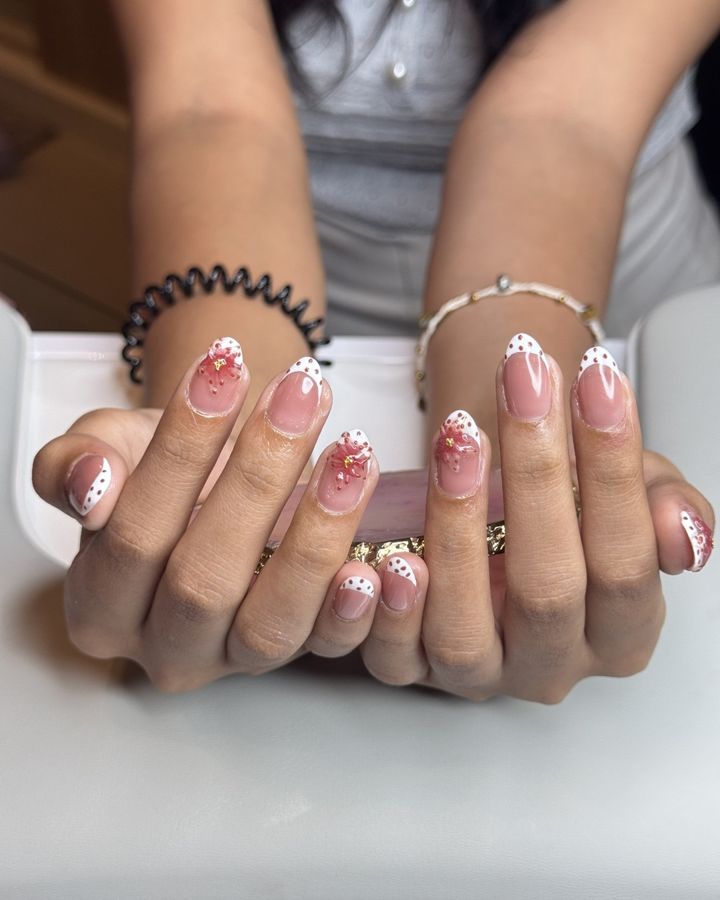 French tip manicure with 3D flowers