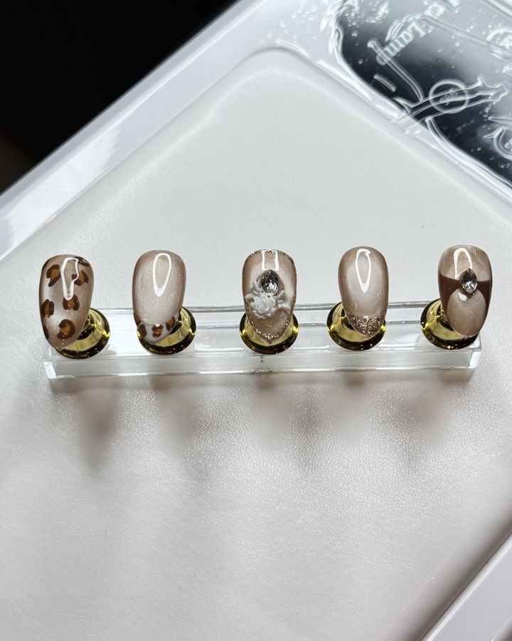 Painted nail art with charms